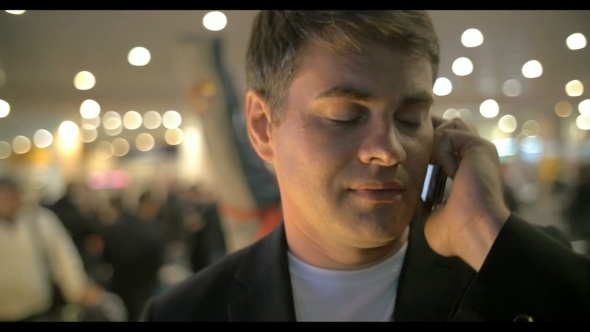 Businessman Having a Phone Talk At The Airport Businessman Having a Phone Talk At The Airport