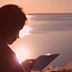 Girl Using Tablet at Dawn Girl Using Tablet at Dawn - VideoHive Item for Sale
