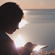 Girl Using Tablet at Dawn Girl Using Tablet at Dawn - VideoHive Item for Sale
