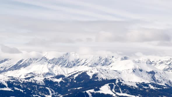 High Mountain Alps Peaks Covered with Clouds Panorama alt