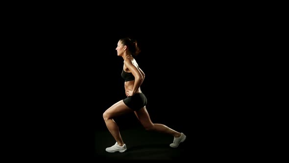 Young Athletic Woman Wearing Sporstwear is Exercising Slow Motion