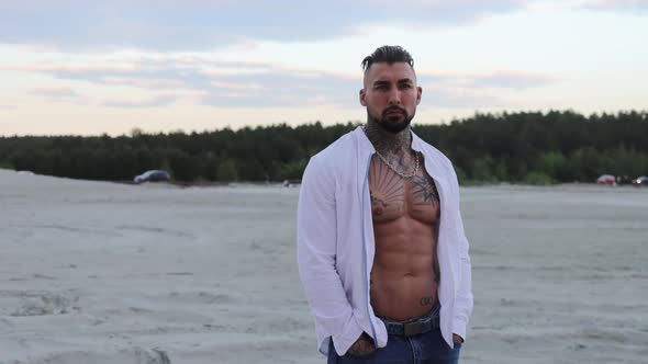 Brutal Man Walking on Beach