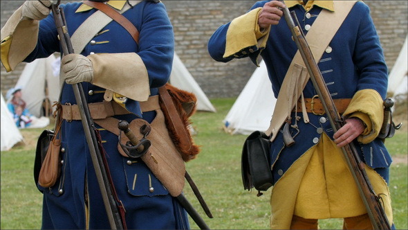 Three Guards Showing How they Put the Bullets