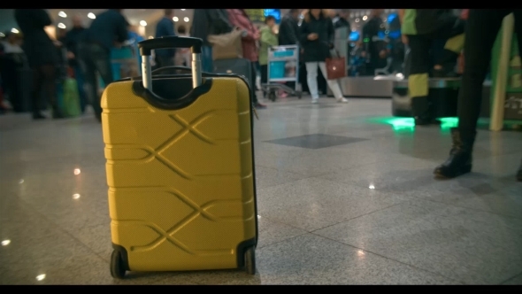 Yellow Trolley Bag In Airport Or Railway Station Yellow Trolley Bag In Airport Or Railway Station