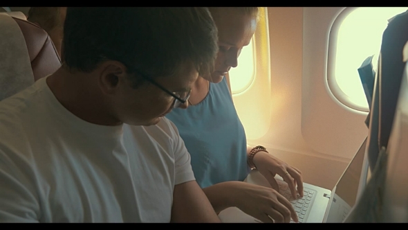 Young People Working With Laptop In Plane Young People Working With Laptop In Plane