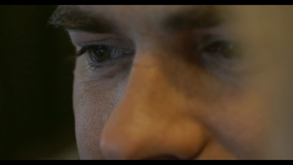 Young Smiling Man With Focus On The Eyes Young Smiling Man With Focus On The Eyes