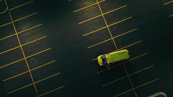Aerial Top View of an Ambulance Standing in the Parking Lot and Waiting for a Call alt