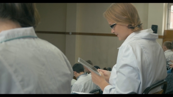 Smiling Medical Student With Pad On The Lecture Smiling Medical Student With Pad On The Lecture