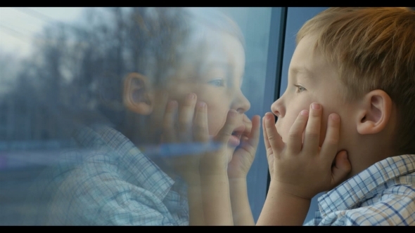 Boy Looking Out The Train Window With Hands On The Boy Looking Out The Train Window With Hands On The