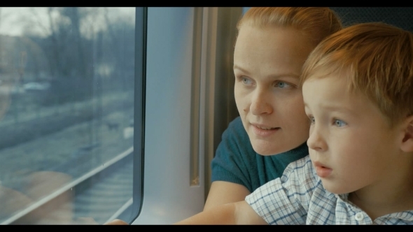 Mother And Son Looking Out Train Window Mother And Son Looking Out Train Window