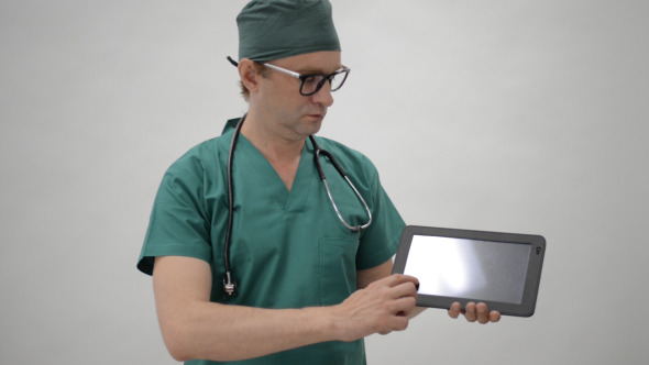 Doctor Showing Detail on Tablet Doctor Showing Detail on Tablet