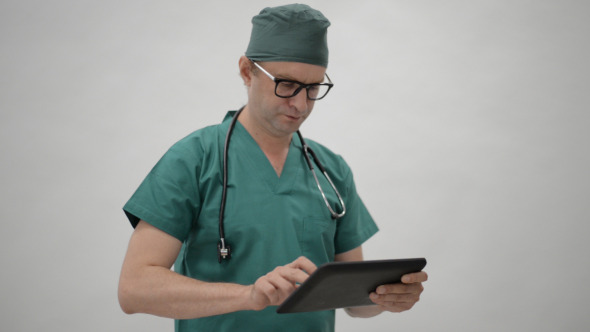 Doctor Typing on Tablet Doctor Typing on Tablet