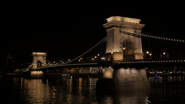 Szechenyi Chain Bridge  by night in Budapest Hungary over river Danube 4K 2160p UltraHD footage -  C alt