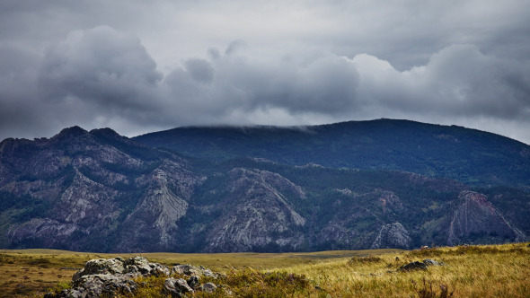 Wild Mountain Landscape With Heavy Clouds