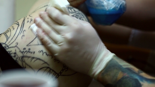 Master Handles Tattoo On Skin Of His Client