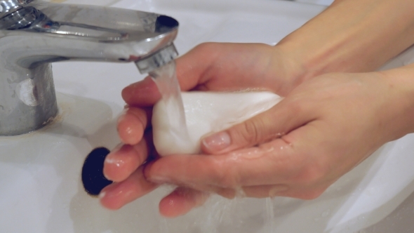 Washing Of Hands With Soap Under Running Water.