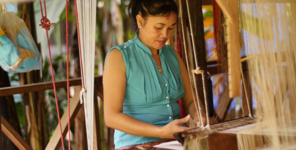 Woman Weaving Silk At Manual Loom Woman Weaving Silk At Manual Loom