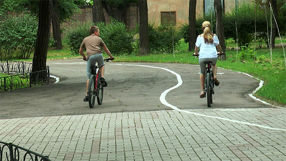 Mother and Son Riding Bicycles Mother and Son Riding Bicycles