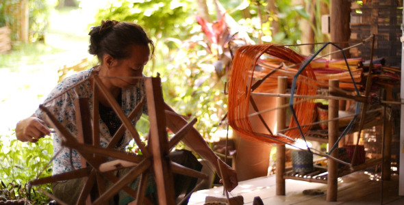 Woman Spinning Silk In Luang Prabang Woman Spinning Silk In Luang Prabang