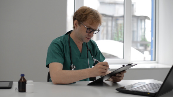 Doctor Checking Patient Documents Doctor Checking Patient Documents