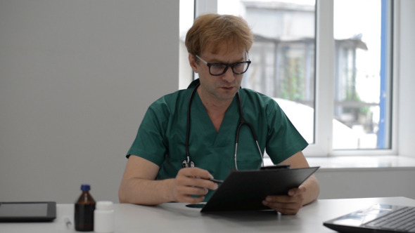 Doctor Reading Medical Report Doctor Reading Medical Report