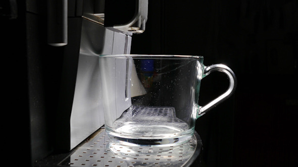 Coffee Machine Making Espresso into a Cup Coffee Machine Making Espresso into a Cup