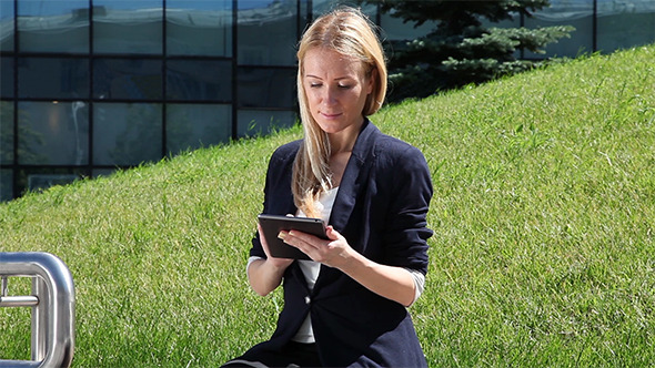 Business Woman Using a Tablet Computer Business Woman Using a Tablet Computer
