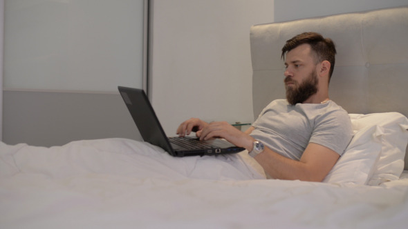 Working on Laptop in Bed Working on Laptop in Bed