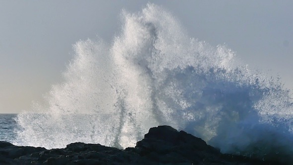 Waves Break On The Rocks