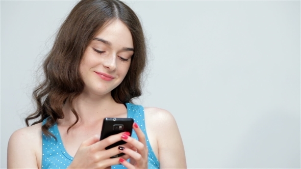 Teen Girl Use Mobile Phone Making Thumbs Up