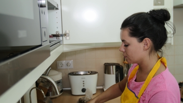 Beautiful Woman Washes Dishes In The Kitchen Sink Beautiful Woman Washes Dishes In The Kitchen Sink