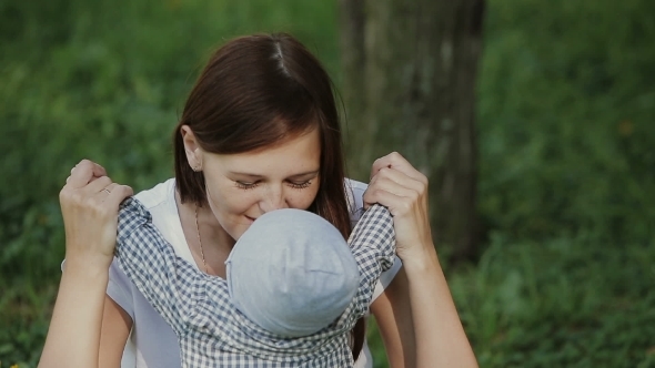 Happy Baby Boy Playing With Mother In The Park Happy Baby Boy Playing With Mother In The Park