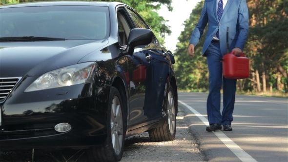 Businessman On The Road With a Jerrycan Businessman On The Road With a Jerrycan