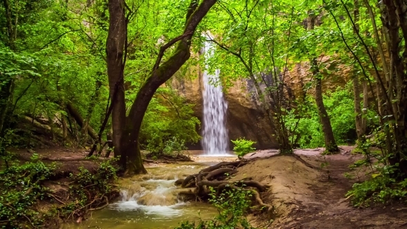 Beautiful Waterfall In Bright Green Forest
