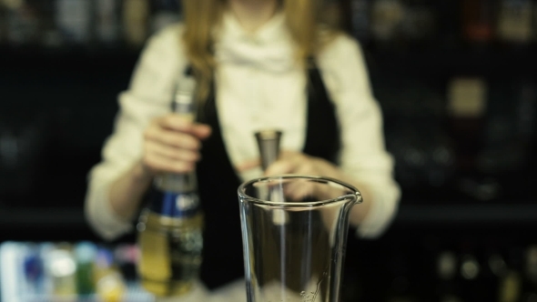 Bartender Pours Vodka In a Glass Bartender Pours Vodka In a Glass