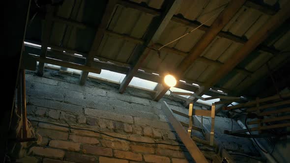 Bulb Swings In Old Shed After Disturbance alt