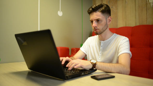 Man Using Laptop Keyboard alt