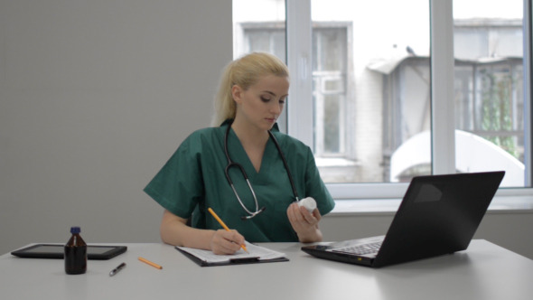 Lady Doctor Writing Medicine for Patient Lady Doctor Writing Medicine for Patient