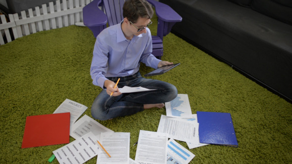 Online Financial Work by Young Casual Man Online Financial Work by Young Casual Man