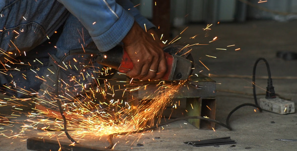 Worker Cuts Metal Worker Cuts Metal