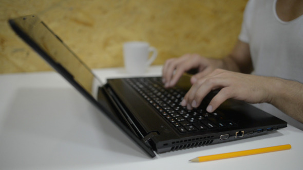 Casual Businessman Typing on Laptop Keyboard Casual Businessman Typing on Laptop Keyboard