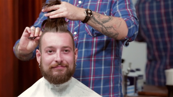 Beard Barber Making Haircut To Hipster Client Beard Barber Making Haircut To Hipster Client