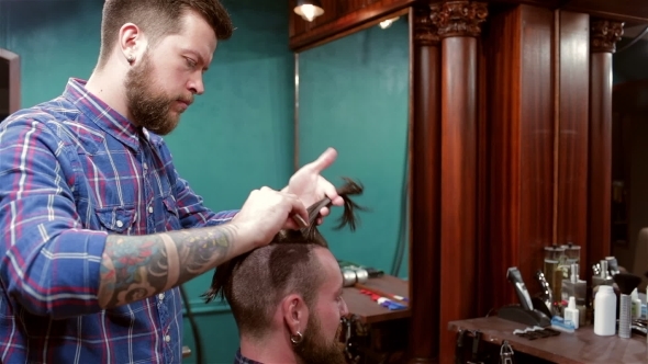 Beard Barber Making Haircut To Hipster Client Beard Barber Making Haircut To Hipster Client