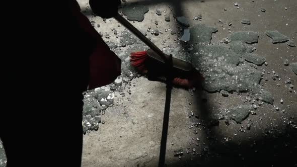 Hand Touches The Pieces of Broken Tempered Glass Hand Touches The Pieces of Broken Tempered Glass