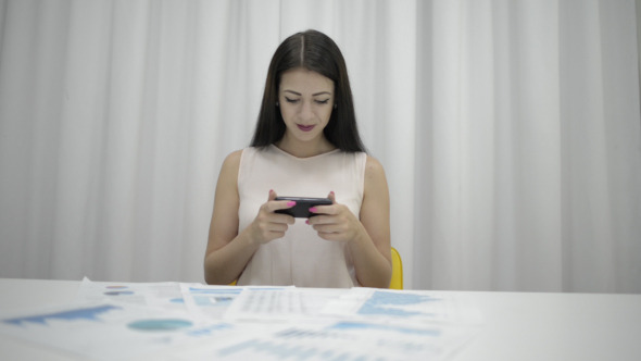Playing Game on Smartphone Playing Game on Smartphone