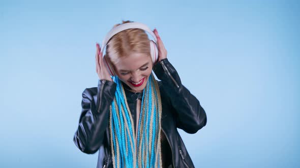 Young Happy Woman in Headphones