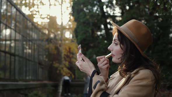 Beautiful Applying Lipstick alt