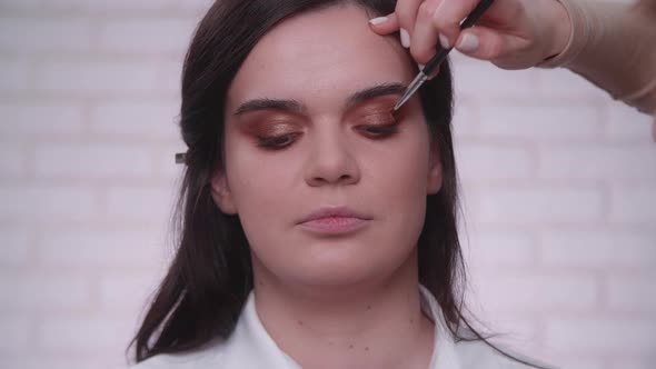 Portrait of Woman in Fashion Studio with White Brick Walls alt