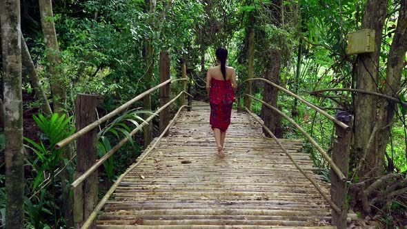Cute Asian Girl Walking on a Bridge in Hot Spring in Slow Motion Thailand