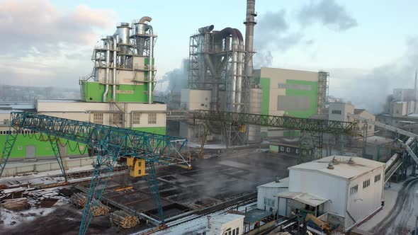 Panorama of a factory with smoking pipes, woodworking industry